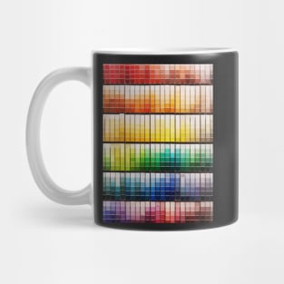 Colorful paint swatches ordered in rainbow order at the hardware store Mug